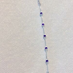 Silver plated 7 inch bracket with amethyst stones and great condition.